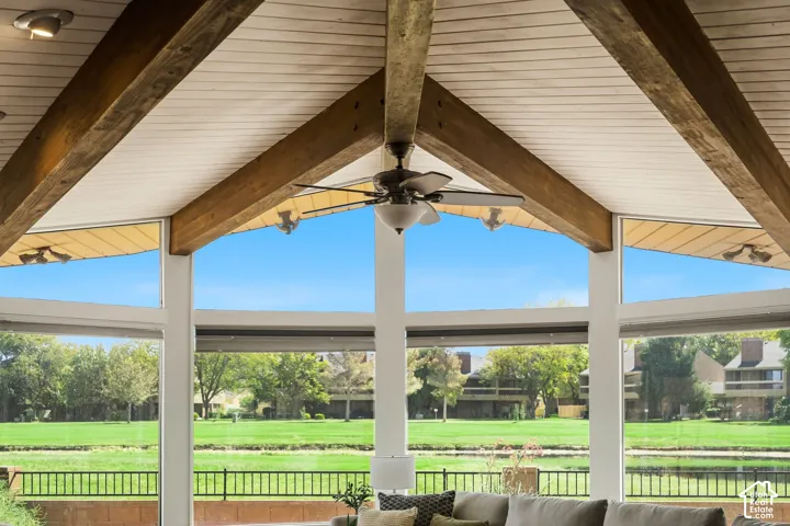Vaulted ceiling with exposed wood beams, ceiling fan, and recessed lighting