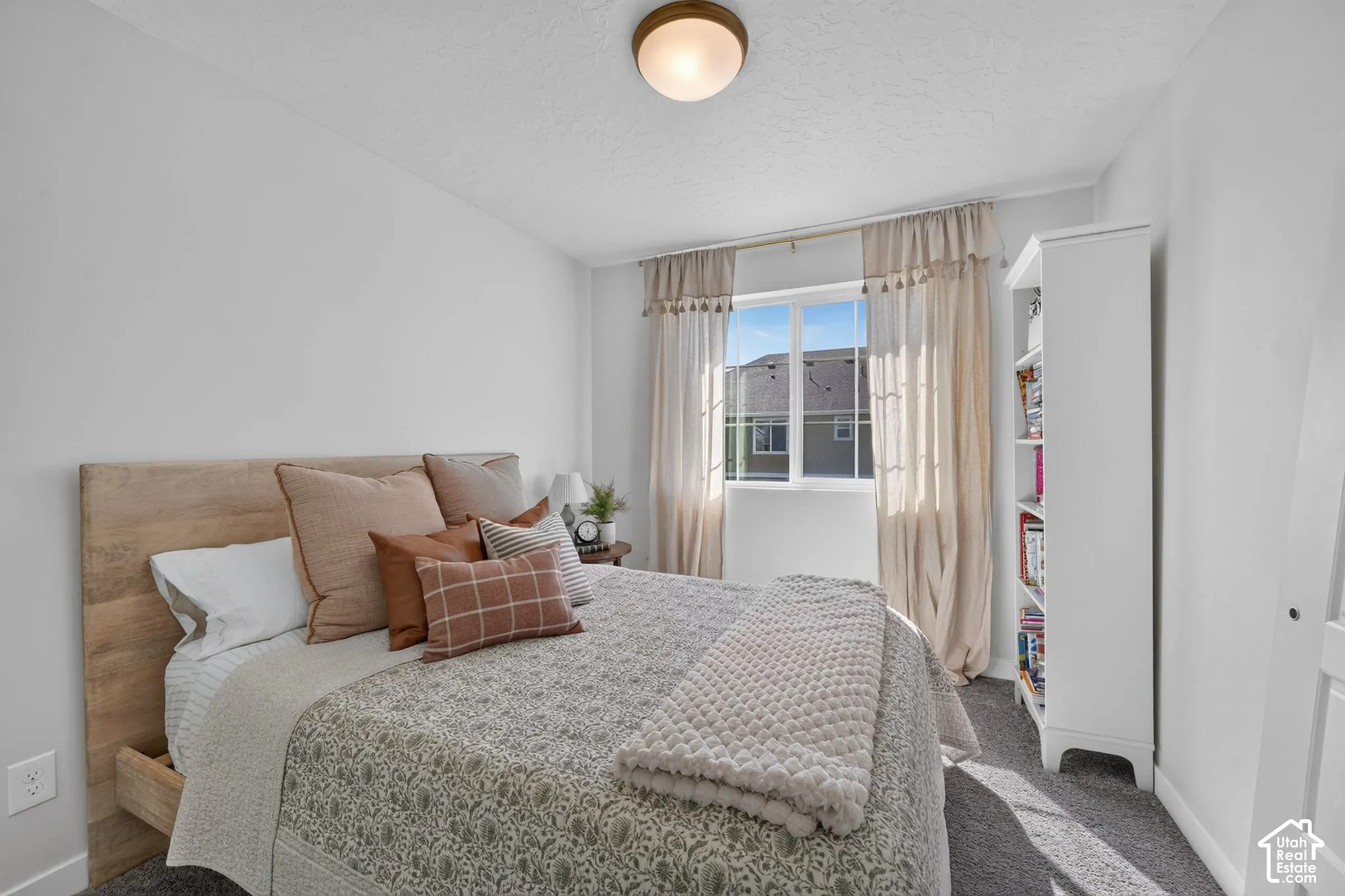 Recessed window with white trim, wall-to-wall carpeting, and a flush mount ceiling light fixture