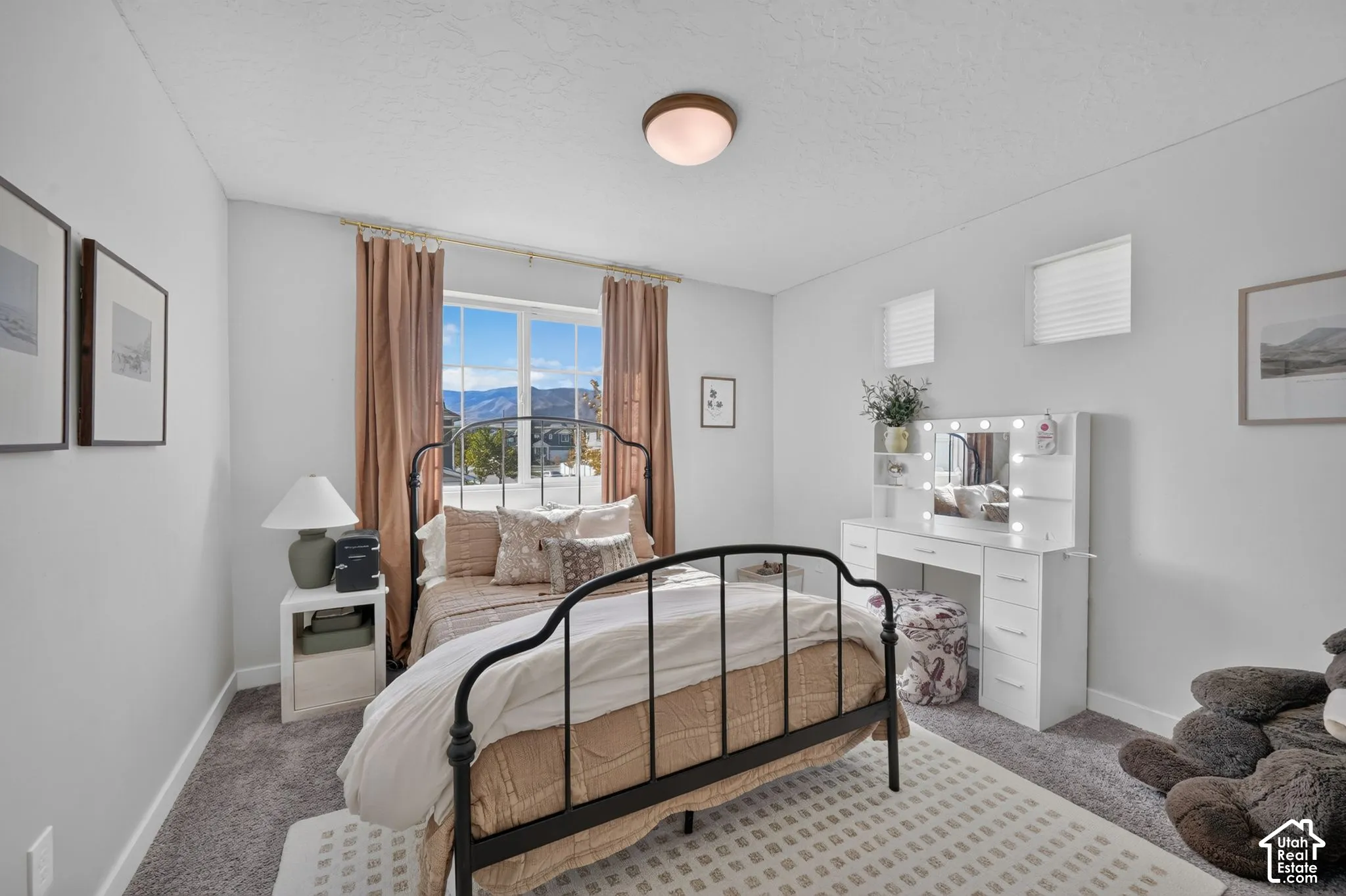 Recessed ceiling light, large window, window blinds, and gray carpet flooring