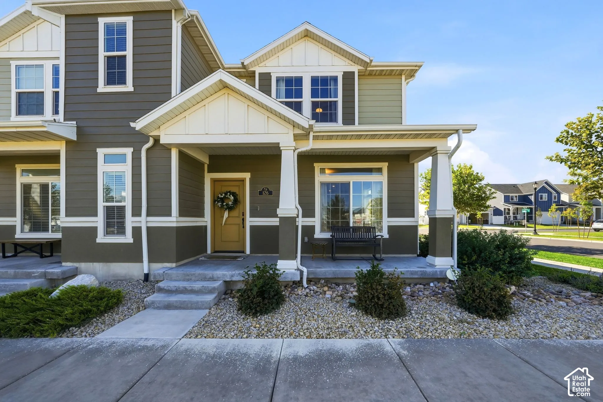Multi-tone siding exterior with a covered porch