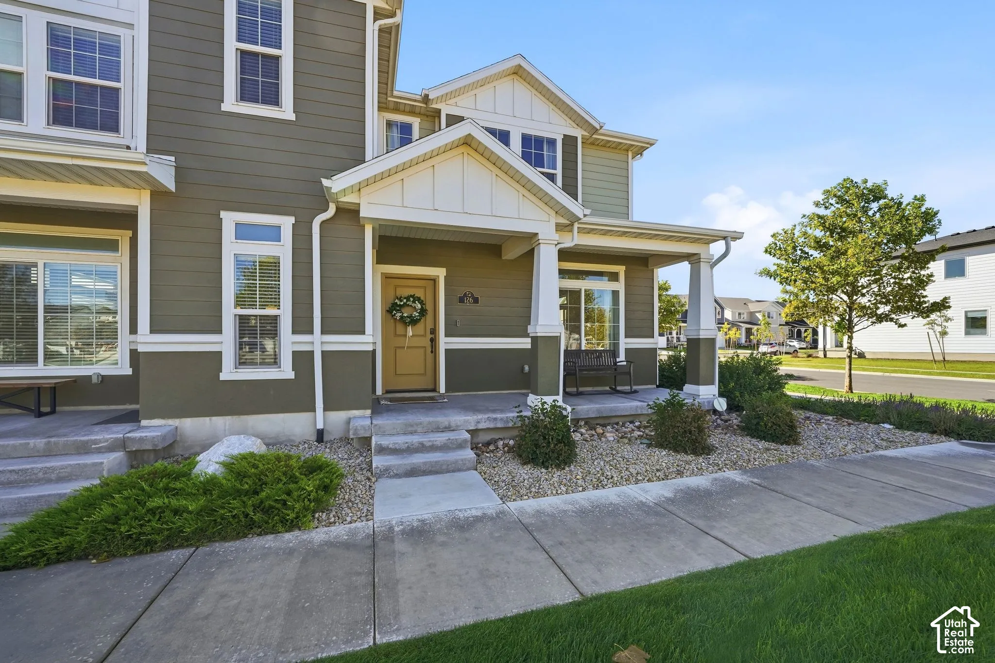 Covered porch entry featuring square columns