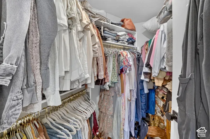 Built-in shelving with multiple storage levels and hanging rods