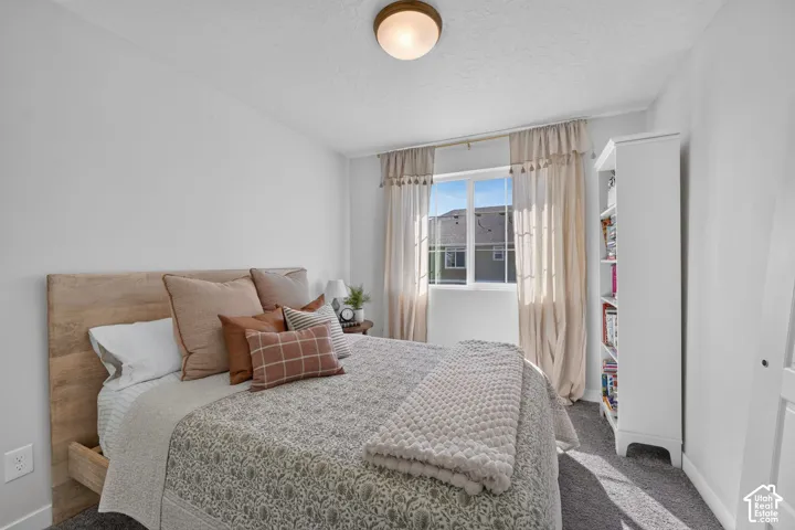 Recessed window with white trim, wall-to-wall carpeting, and a flush mount ceiling light fixture