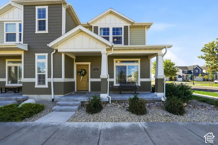 Multi-tone siding exterior with a covered porch
