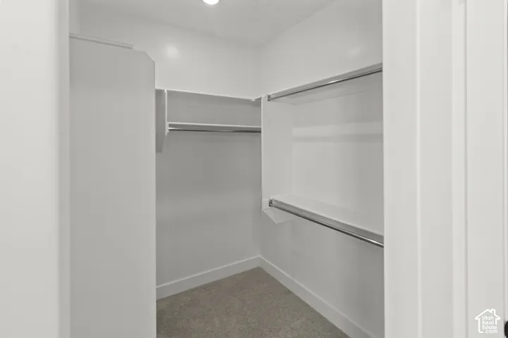 Walk-in closet with integrated shelving and hanging rods