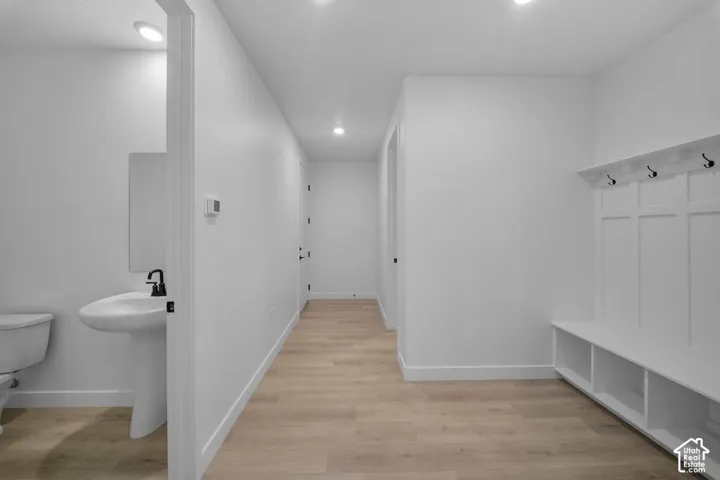 White walls and trim with wood-finish flooring