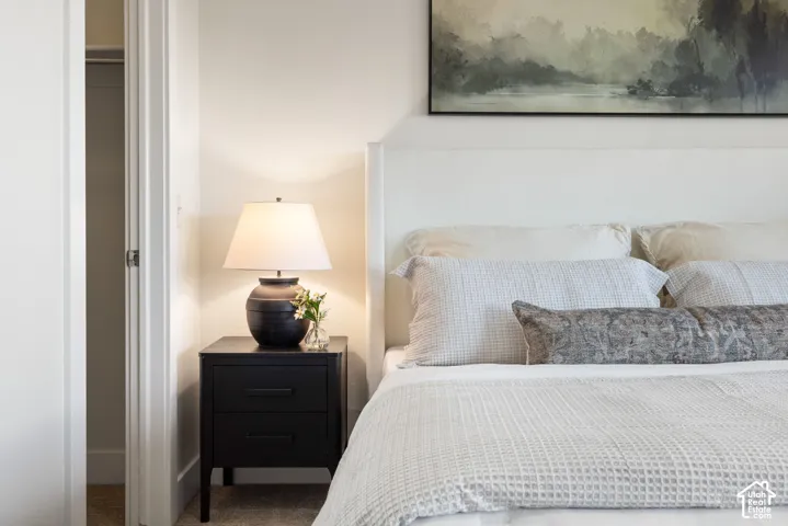 Built-in closet with white trim and a contrasting dark door handle