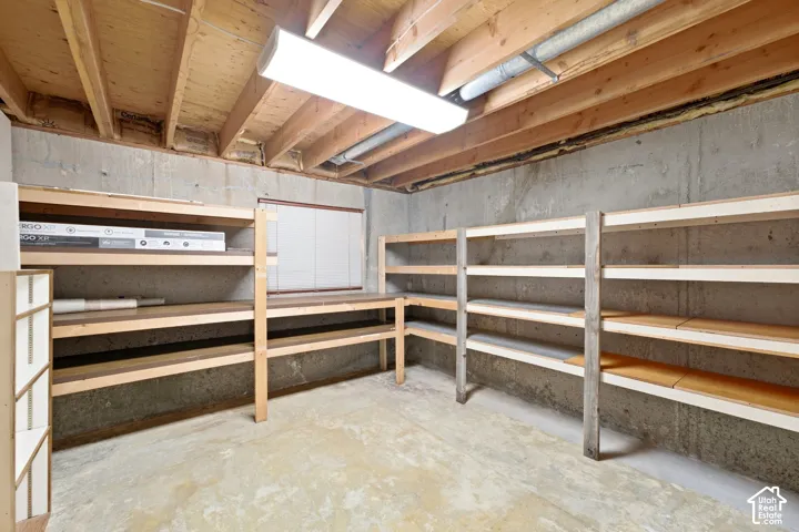 Concrete foundation walls with exposed wood ceiling joists