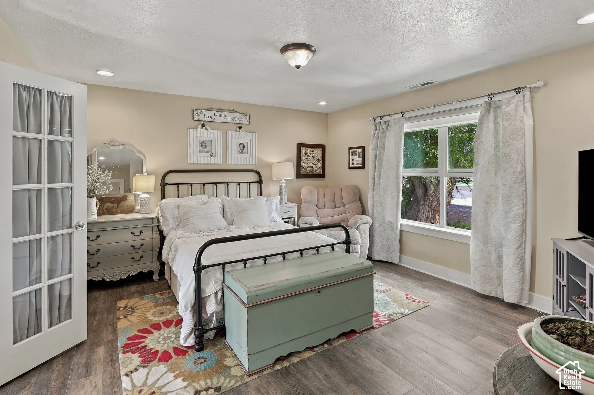 Wood-finish flooring, recessed lighting, and a window with exterior visibility