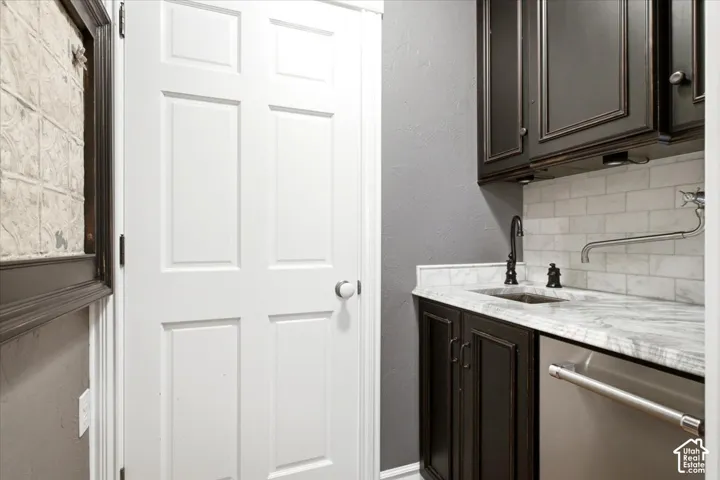 Custom cabinetry with a light-toned countertop and subway tile backsplash