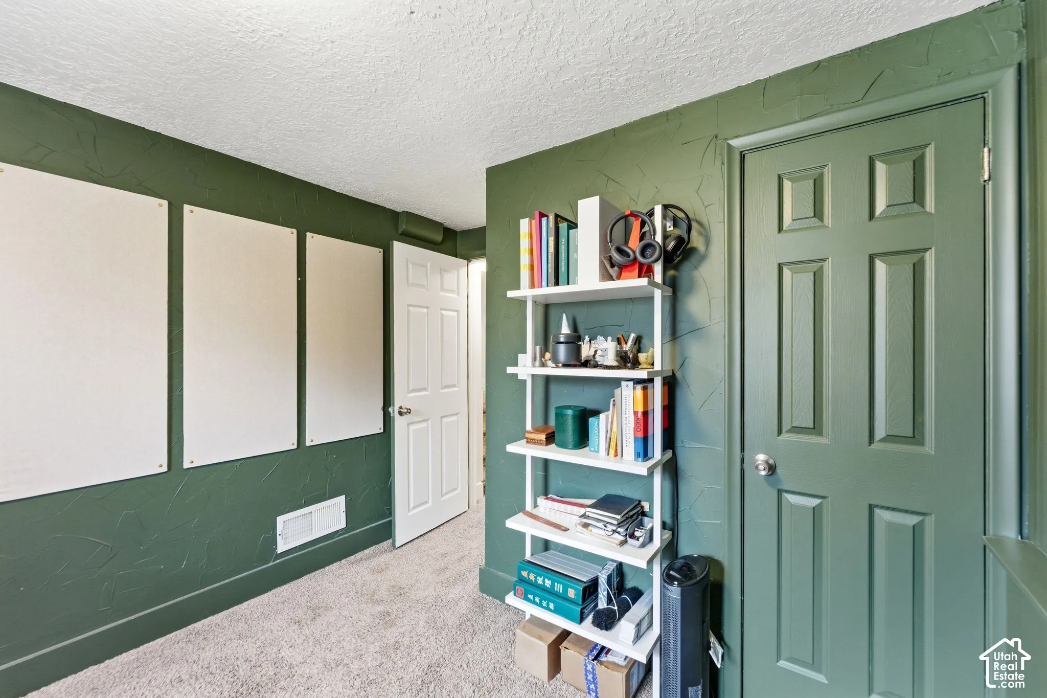 Textured wall finish, paneled interior doors, and carpet flooring