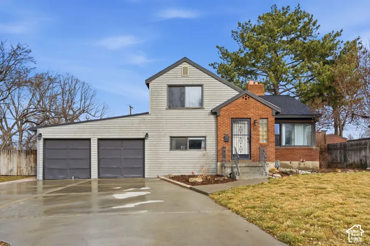 Brick and siding exterior with a two-car garage