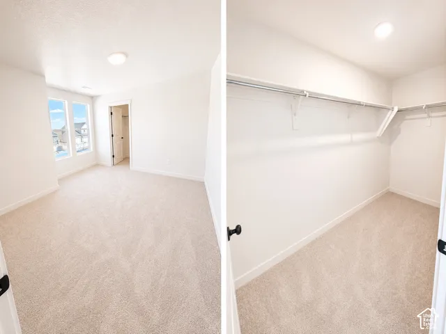 Spacious room with plush carpeting, natural light from multiple windows, and a walk-in closet featuring built-in shelving and hanging rods