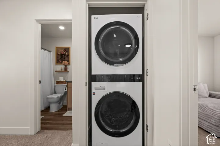Stacked laundry appliances within a dedicated closet