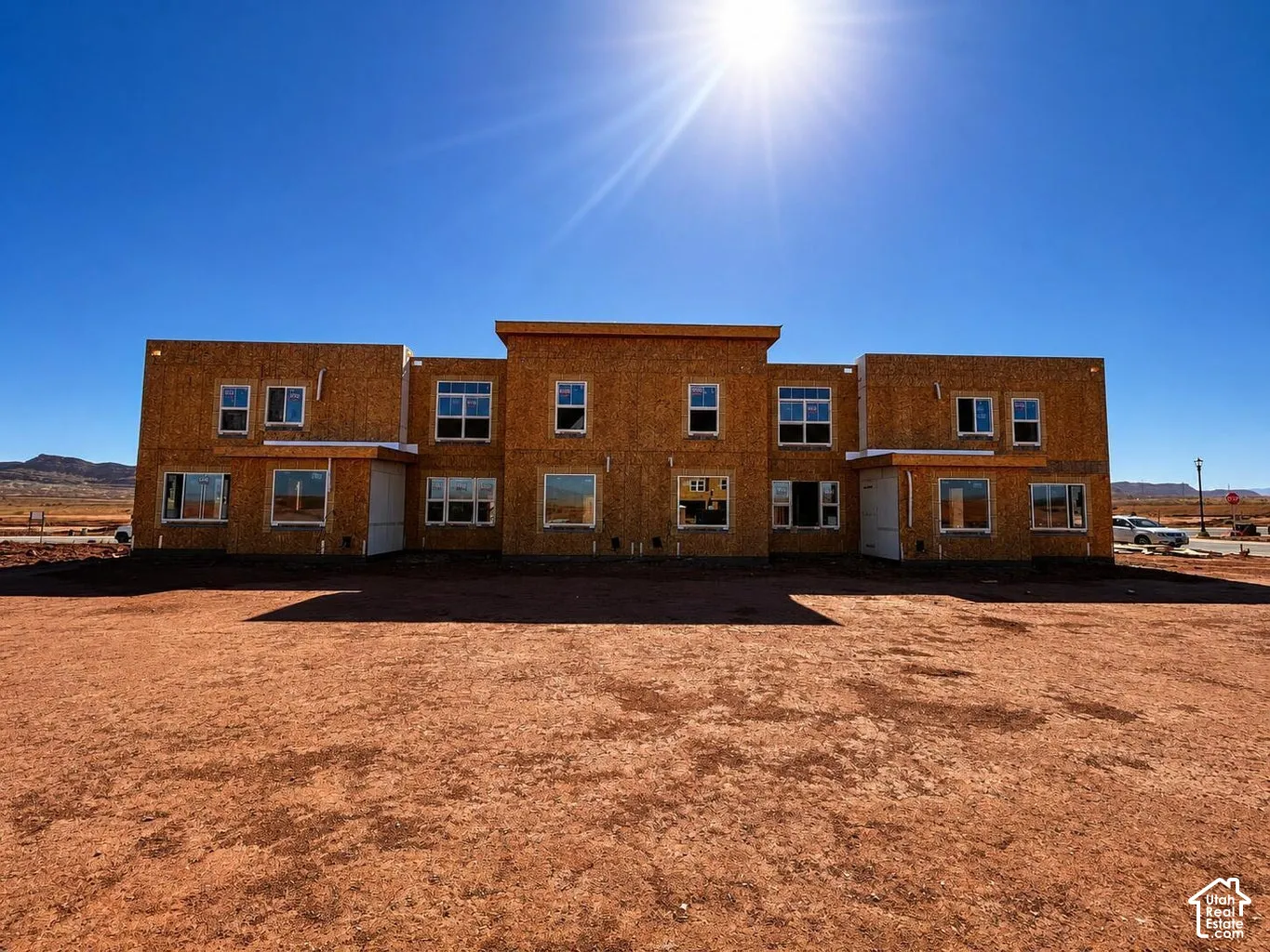 New construction structure with multiple window openings across two levels