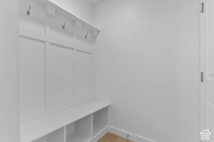 White built-in bench with integrated storage cubbies