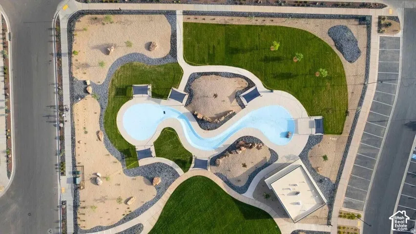 Recreational complex featuring a meandering water feature, extensive green spaces, and designated activity areas