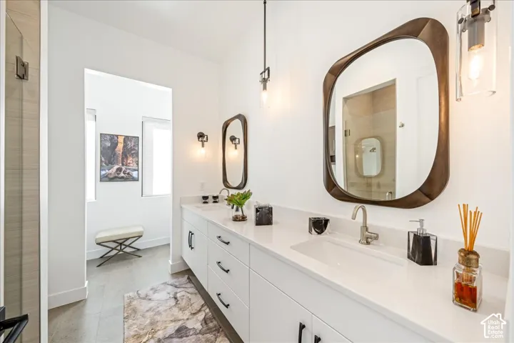 Dual vanity with integrated sinks and white countertops
