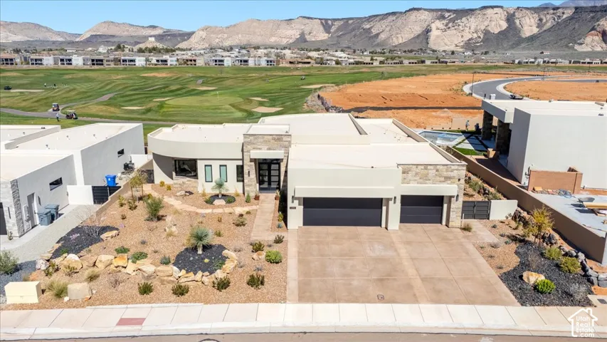 Contemporary exterior with stone accents and a flat roofline