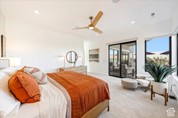 Recessed lighting, wood-finish ceiling fan, full-height sliding glass doors, and large windows with roller shades
