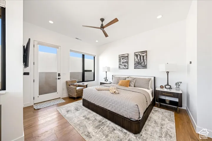 Wood-finish flooring, recessed lighting, and a modern ceiling fan