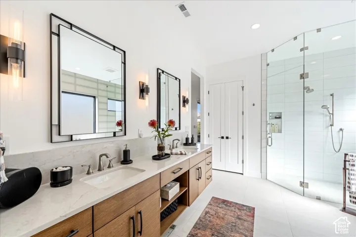 Dual vanity with wood-finish cabinetry and white countertops