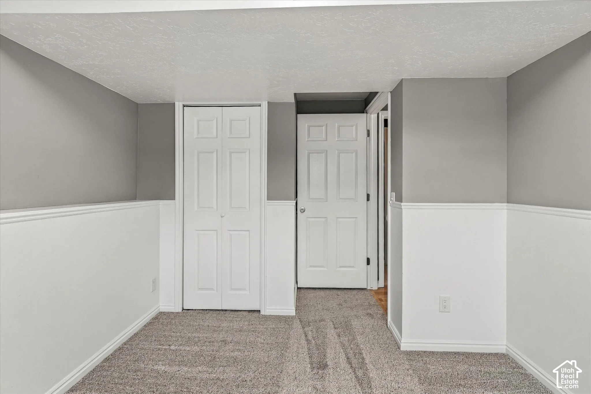 Wall-to-wall carpeting with bi-fold closet doors