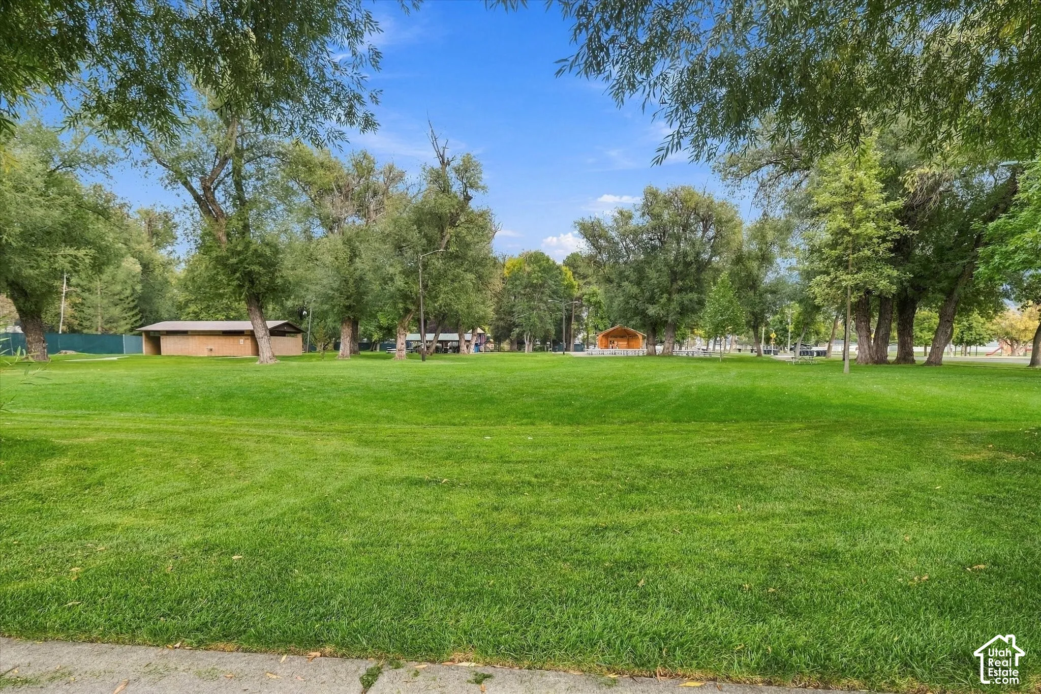 Expansive green space with mature trees
