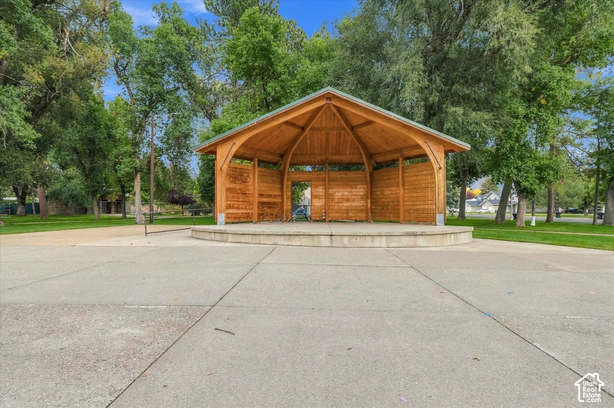 Open-air pavilion featuring a high-pitched roof and exposed timber framing