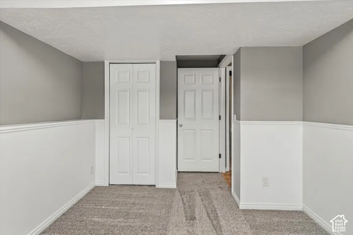 Wall-to-wall carpeting with bi-fold closet doors