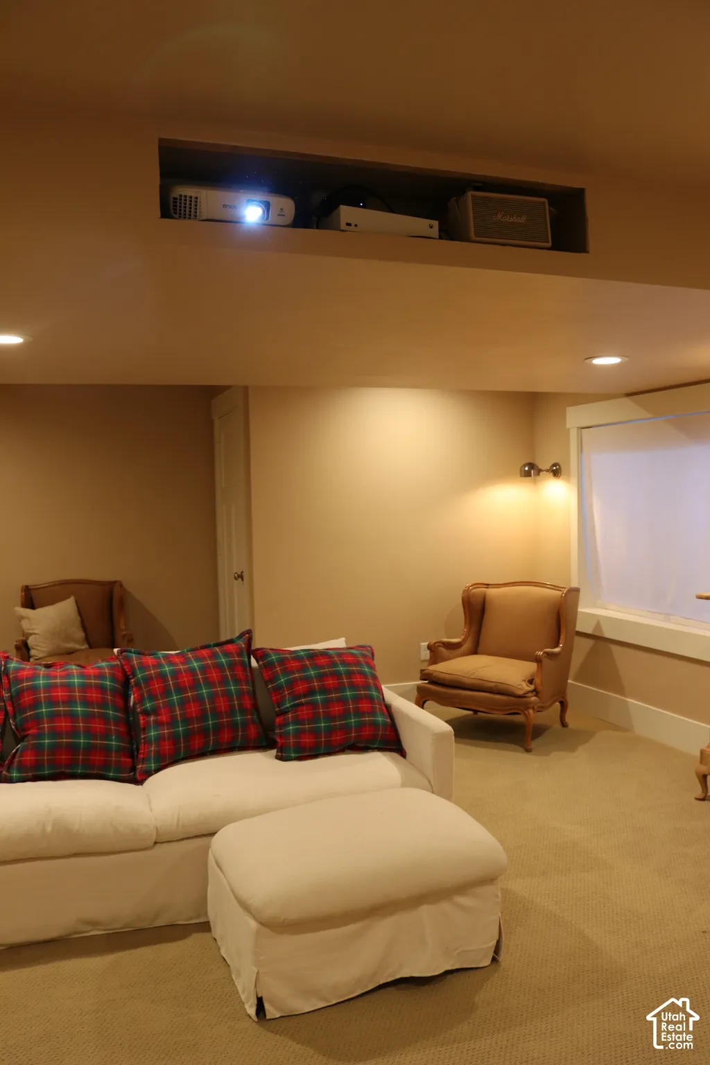 Recessed ceiling niche, recessed lighting, wall-mounted sconce, and carpeted flooring