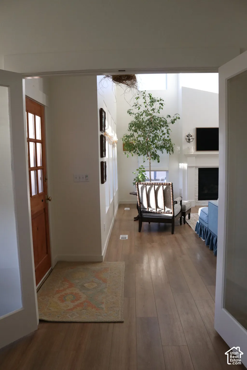 Wide plank wood-finish flooring throughout