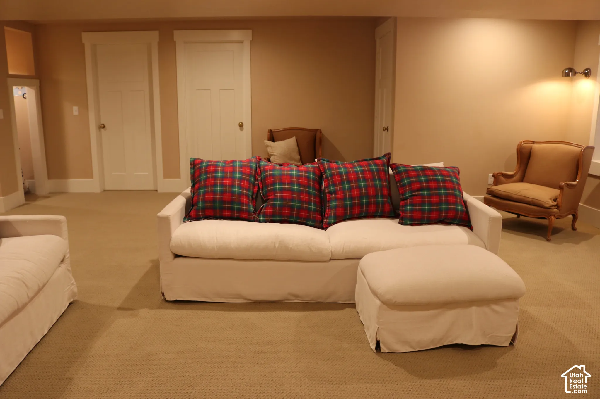 Carpeted flooring, recessed wall lighting, and two panel doors