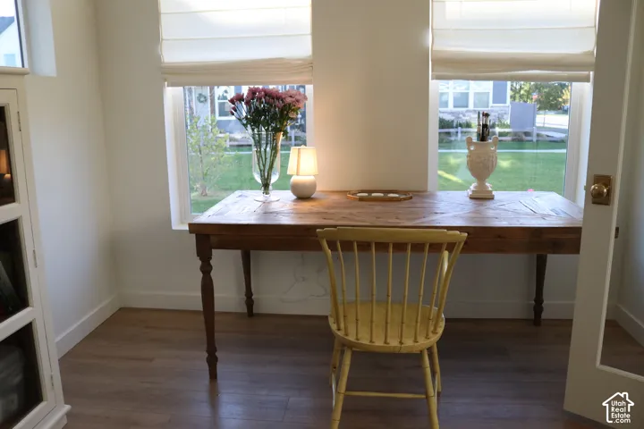 Wood-finish flooring throughout, paired with white walls and trim