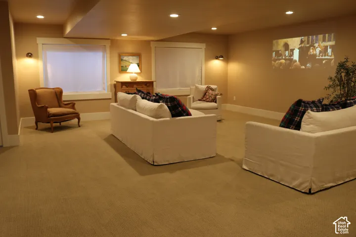 Recessed lighting, wall sconces, two windows, wall-mounted projection