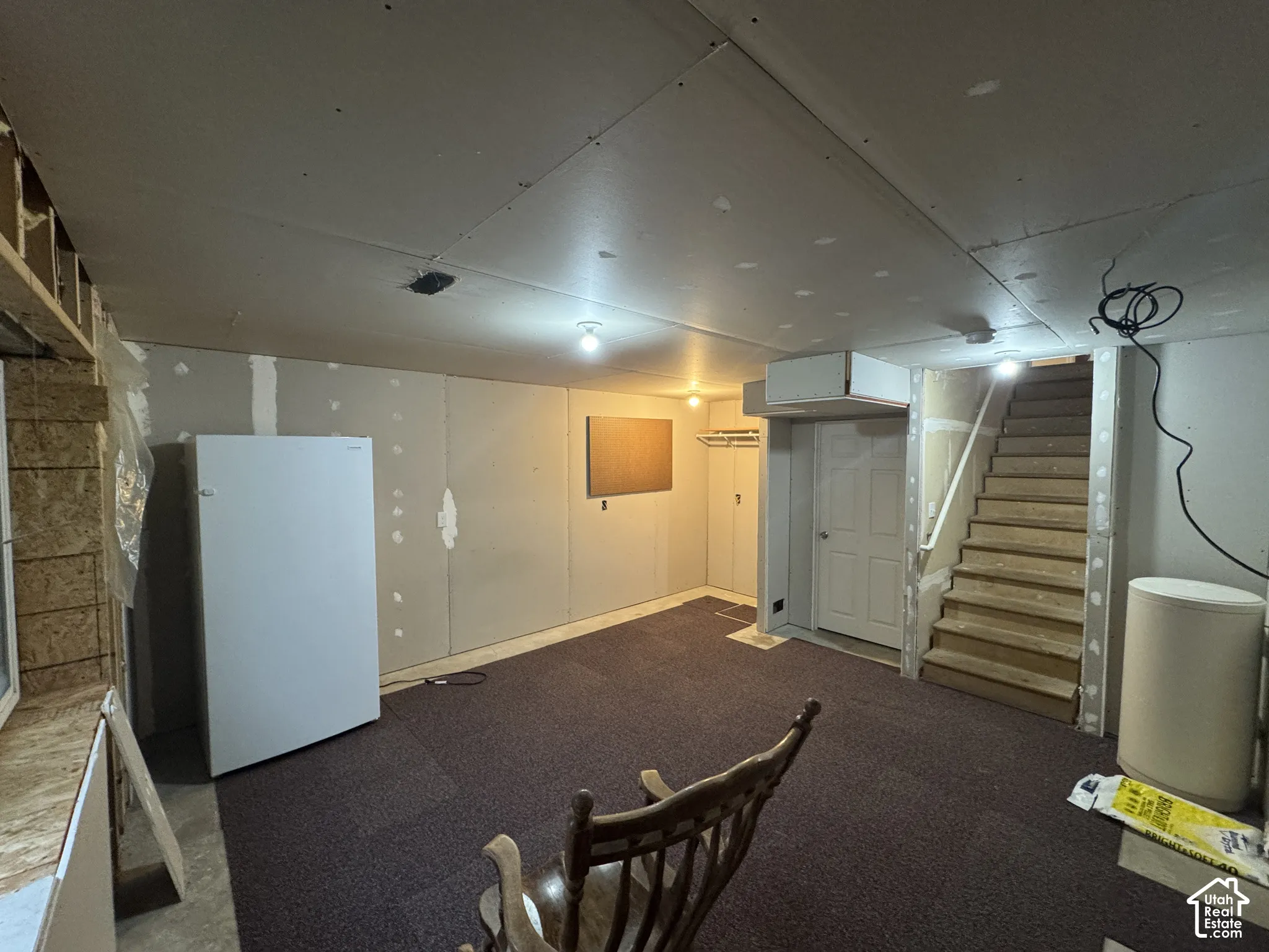 Furuter Basement Family Room Partially Finished.  Door on the left hand side is a "partially finished future bedroom."