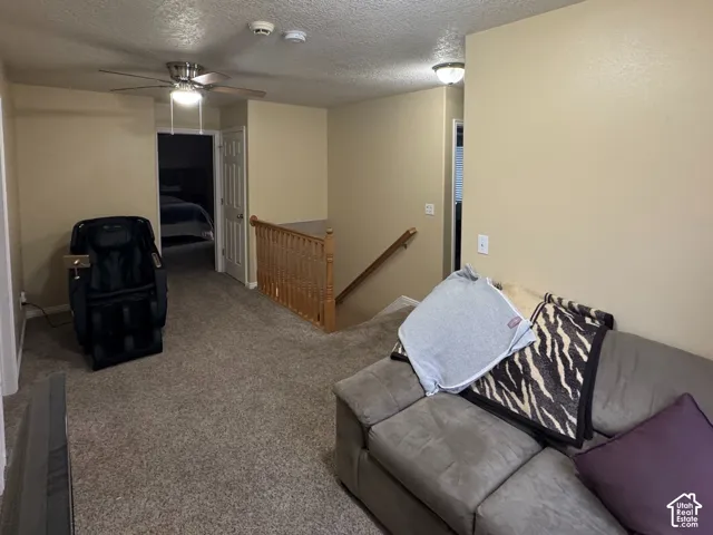 Carpeted Loft Family Room with recessed lighting, ceiling fan, and wood railing