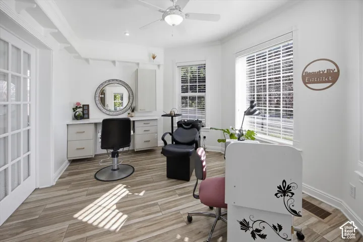 Recessed lighting, wood-finish flooring, and crown molding