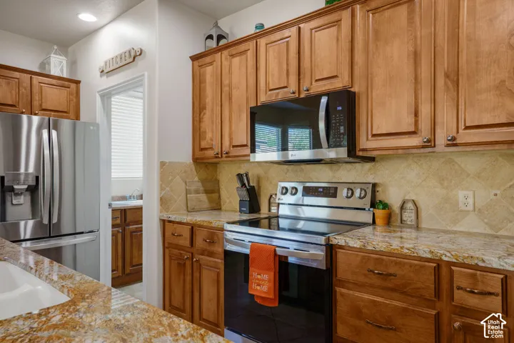 Wood-finish cabinetry paired with granite countertops
