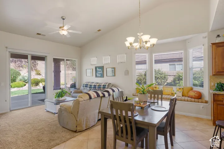 Vaulted ceilings, ceramic tile flooring, built-in window seating, and a dining area chandelier