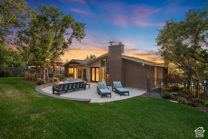 Expansive backyard with a large patio, gas fire table, professionally landscaped with low voltage lighting throughout!