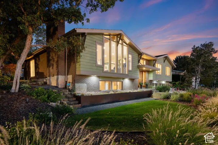 Modern architectural facade featuring large picture windows offering gorgeous valley views