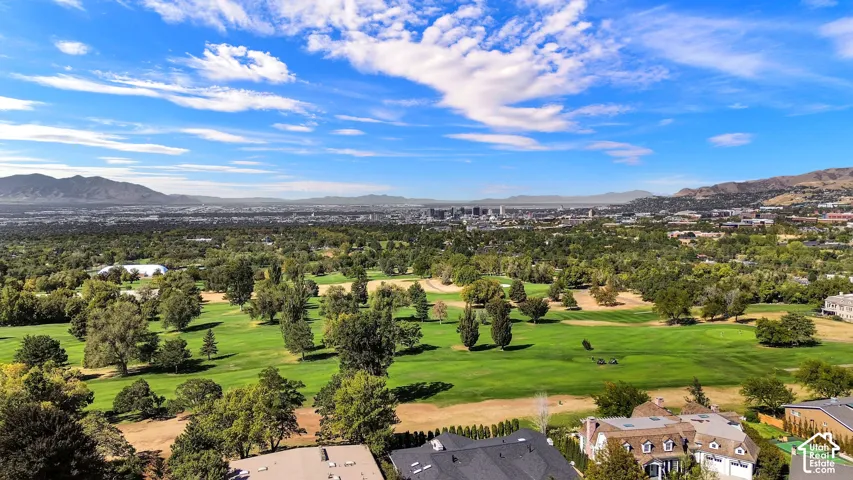 Bonneville golf course close with distant city and mountain scenery