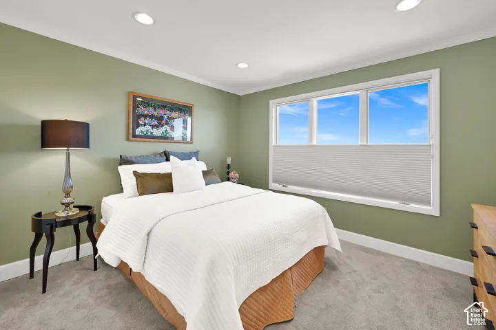 Main floor bedroom with beautiful valley views! Recessed lighting, crown molding, and carpeting throughout