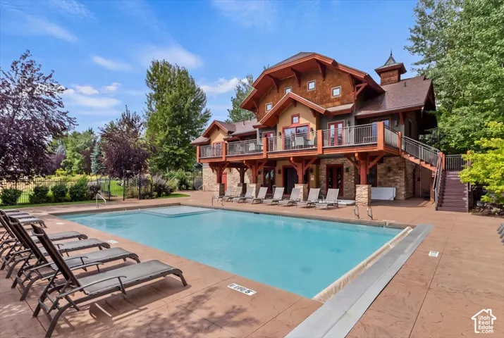 Community clubhouse featuring a pool