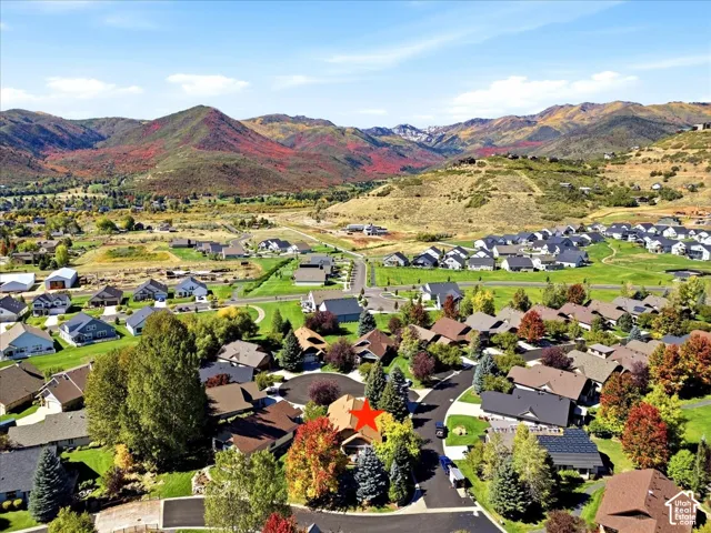 Aerial view of home surrounded by beautiful mountains