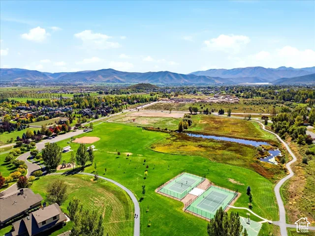 Expansive community green space with paved walking paths
