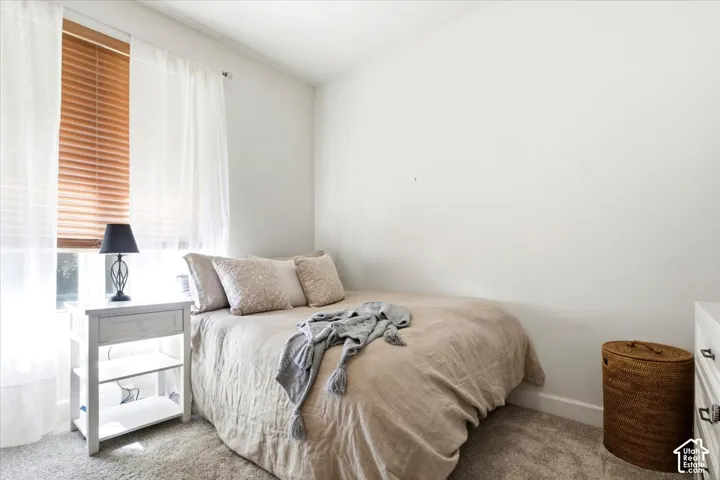Bedroom featuring tall ceilings