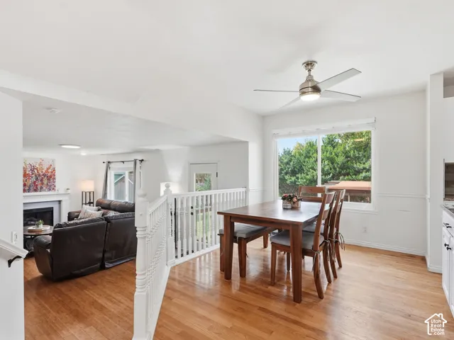 Hardwood flooring throughout, with a white spindle railing