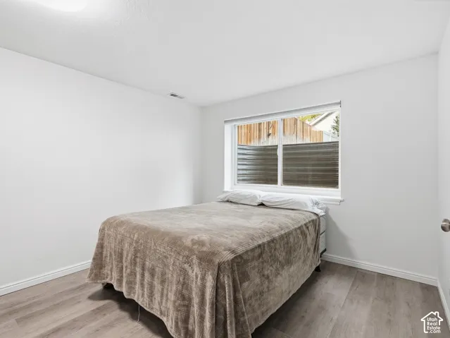Neutral white walls with a semi-flush mount ceiling light